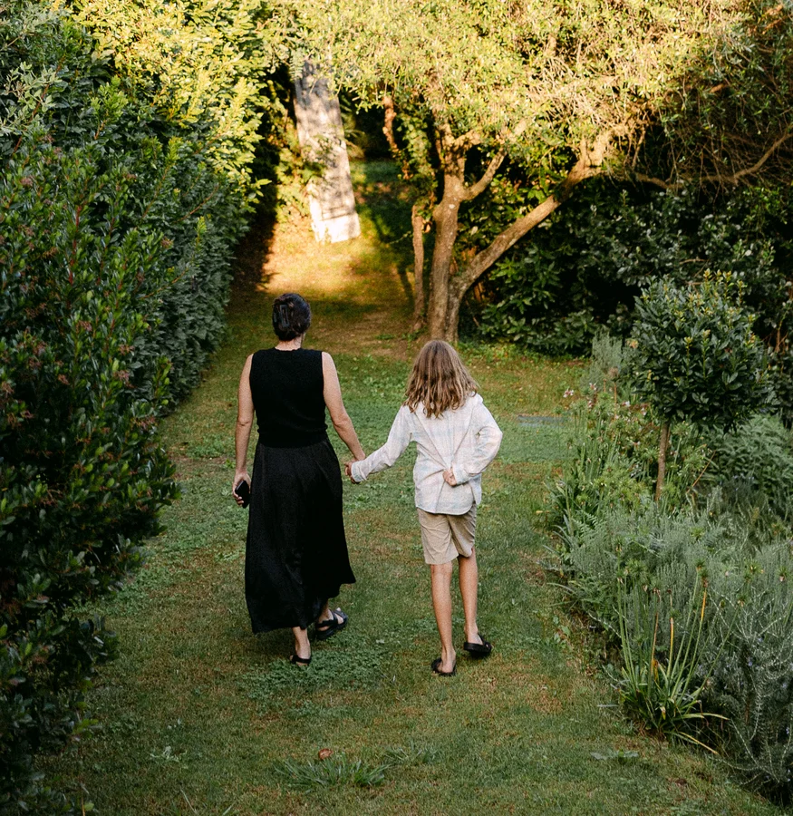 Mother and daughter walking in the garden at Il Podere di Toscana Tuscany