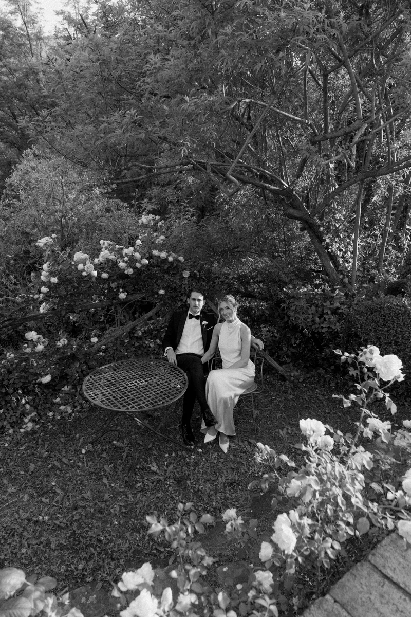 Bride and groom in the rose garden — intimate wedding at Il Podere di Toscana Tuscany